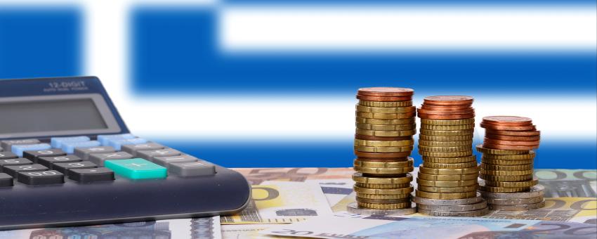 Calculator with money and coins in front of flag of Greece