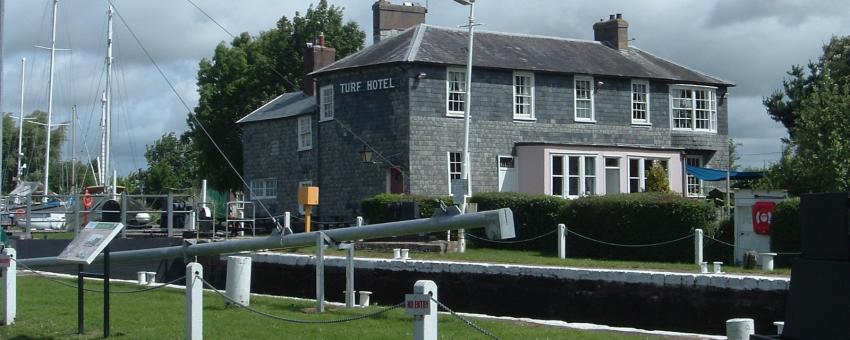 The Turf Hotel Devon.  At the outflow of the Exeter canal into the river Exe, via locks.