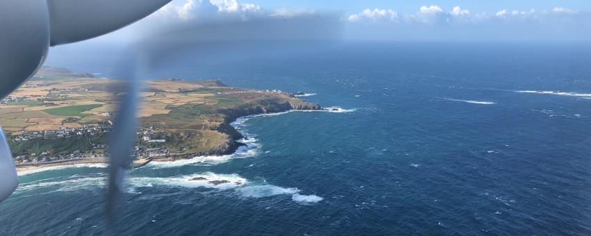 Flying to the Isles of Scilly over Sennen Cove