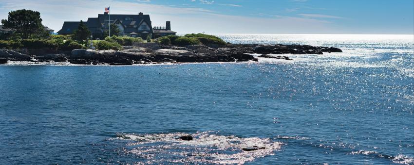 The Bush Family estate on the shore of Kennebunkport, Maine. The ocean glare and brilliant sparkles are the effect of a late afternoon sun low on the horizon.