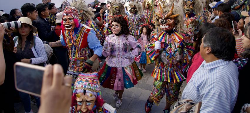 Paucartambo Saqra dancers with crowd